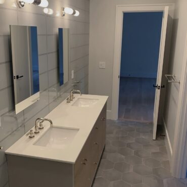 Modern Bathroom Renovation: Hexagon Tiles and Minimalist Design in Connecticut