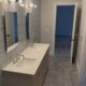 Modern Bathroom Renovation: Hexagon Tiles and Minimalist Design in Connecticut