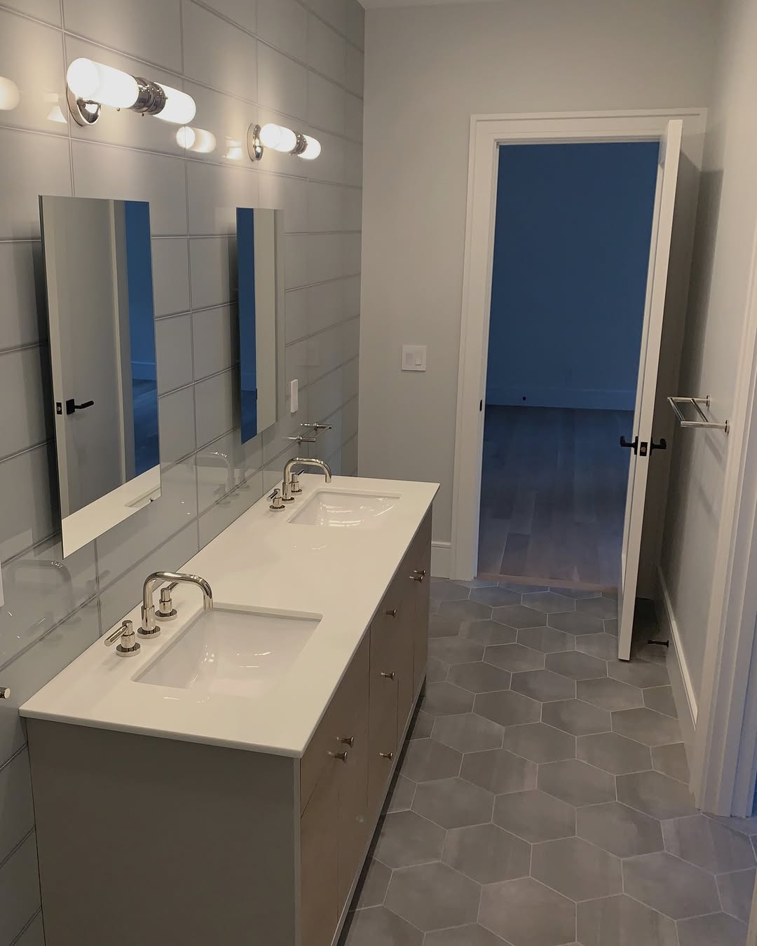 Modern Bathroom Renovation: Hexagon Tiles and Minimalist Design in Connecticut