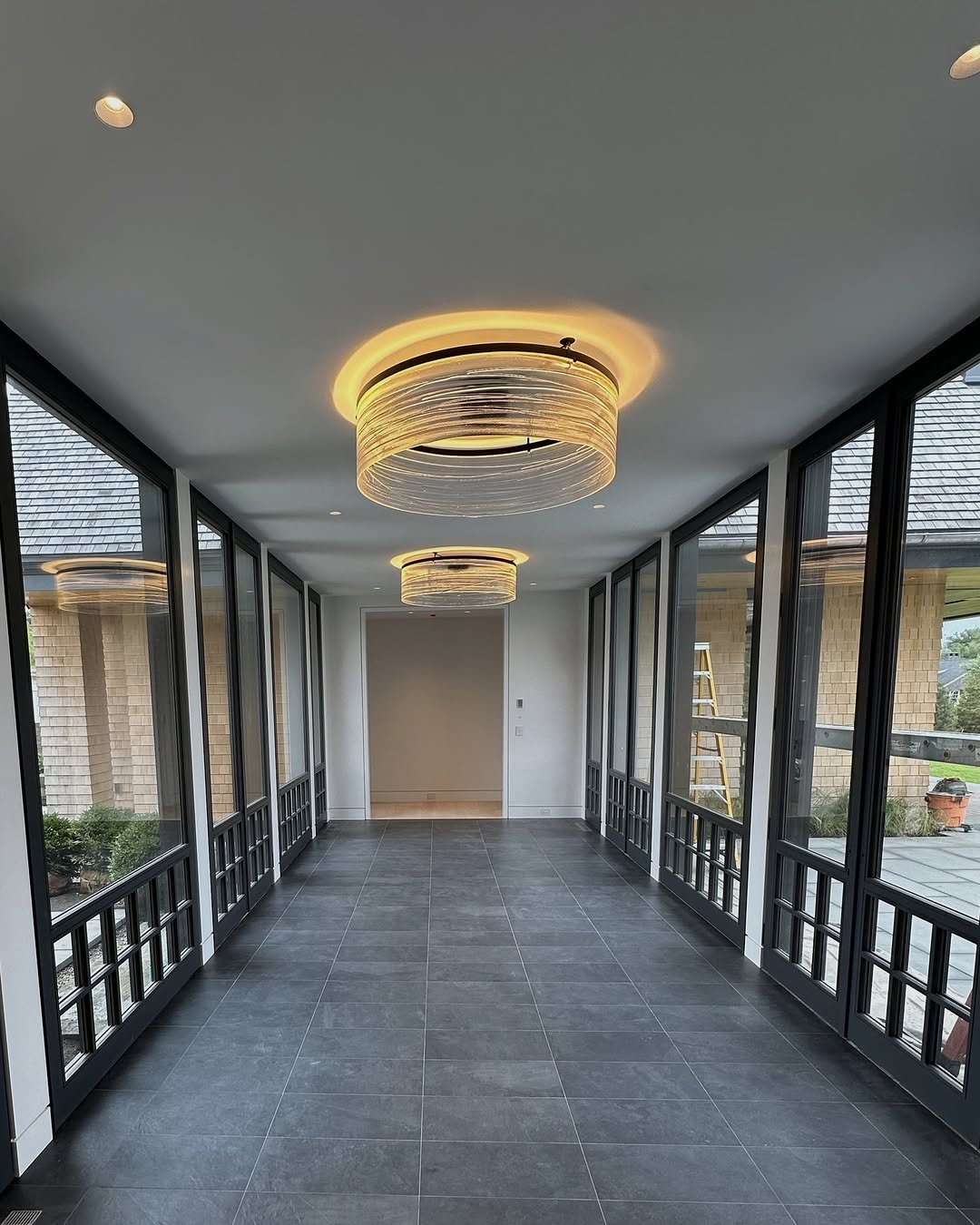 Modern Hallway Design: Grey Tiles and Natural Light for Connecticut Homes